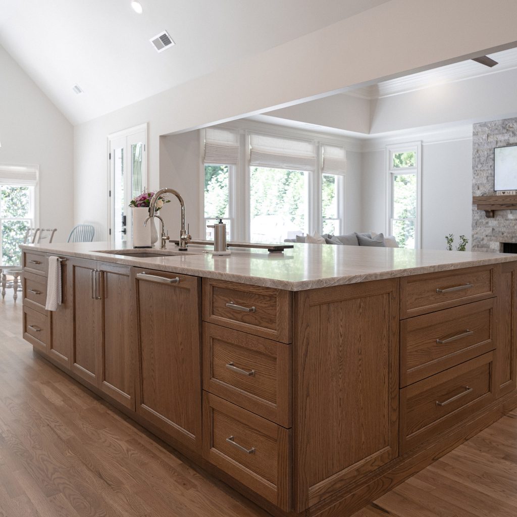 Stained-oak kitchen island with quartz counters, an undermount sink, and a polished-nickel gooseneck faucet.